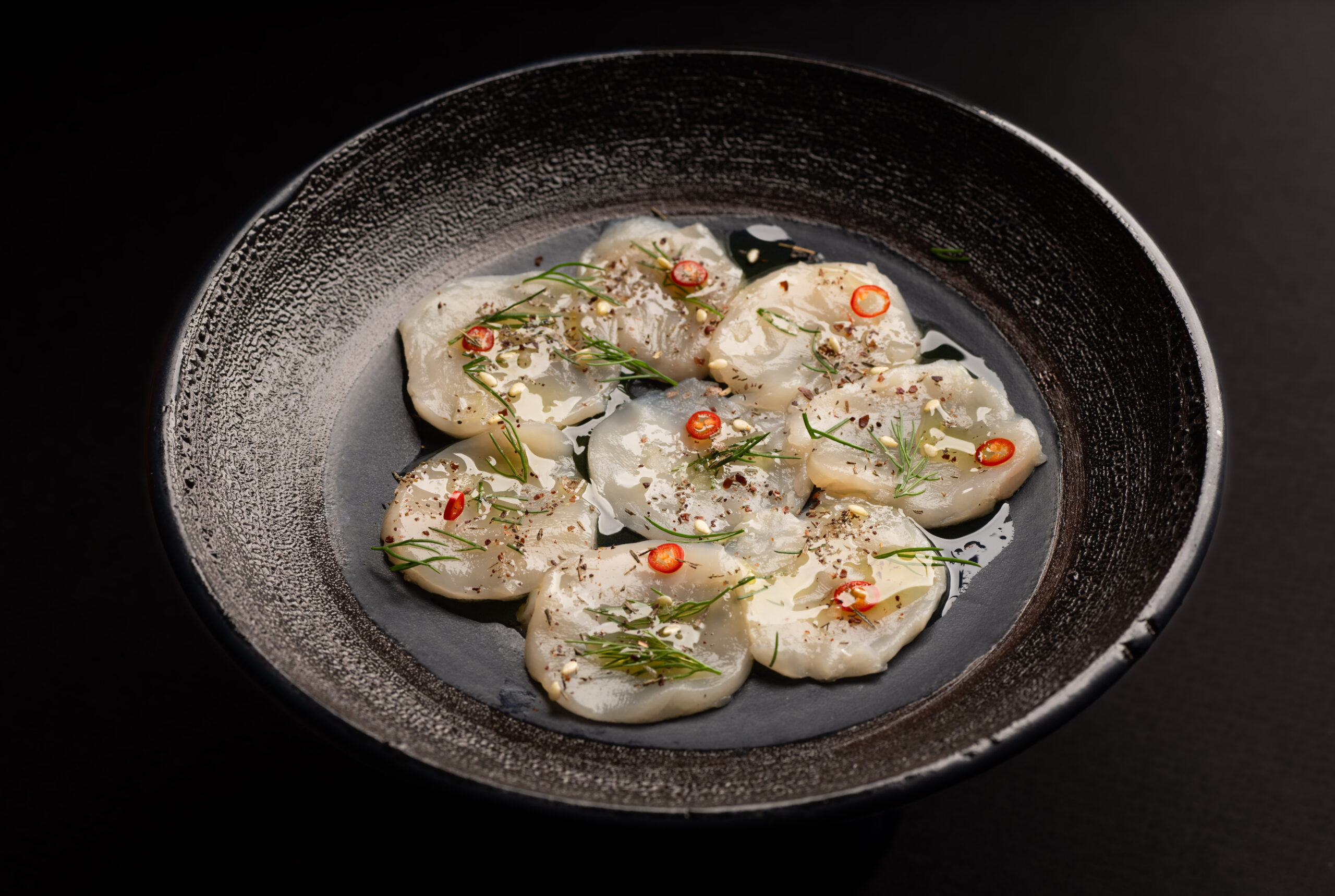 Aqua Cultured Food fish-free scallop plated dish.